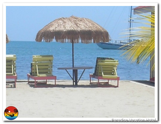 Chairs by water by Alan Stamm